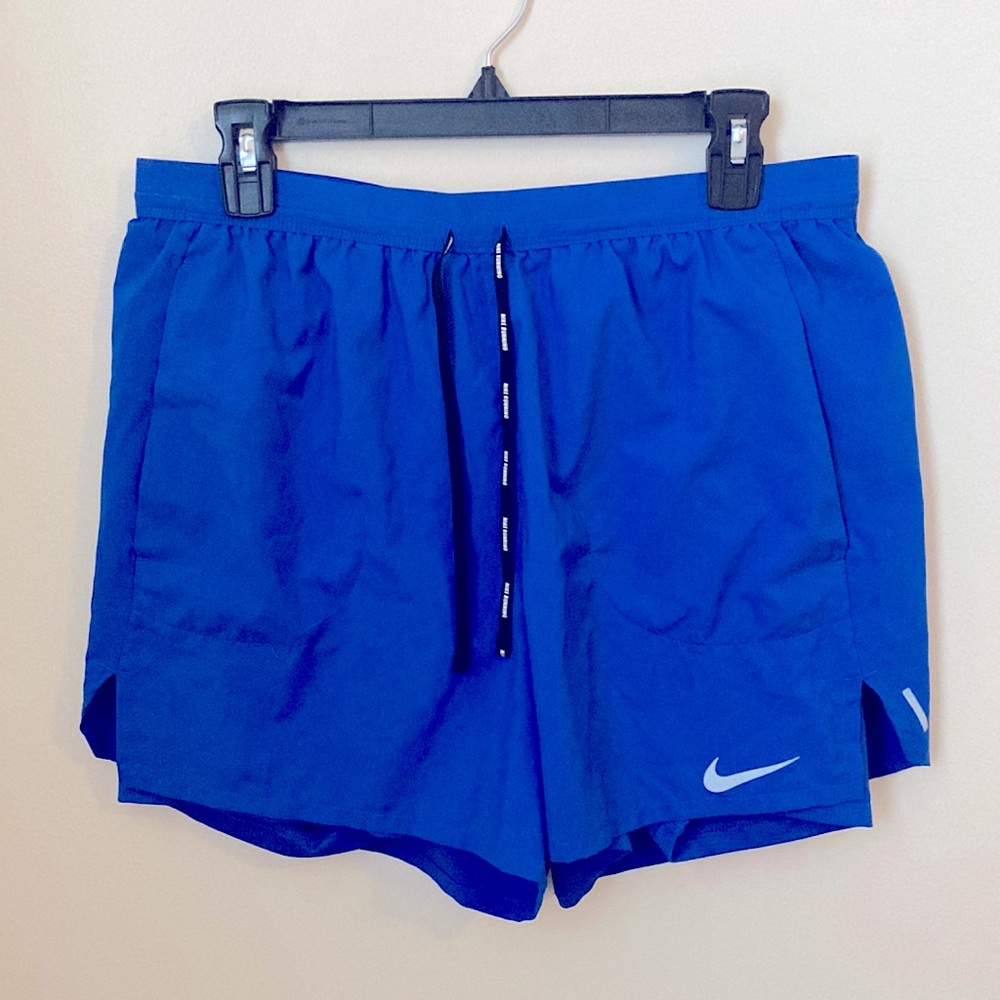 Nike running shorts. Blue with black ties and spandex shorts underneath-attached